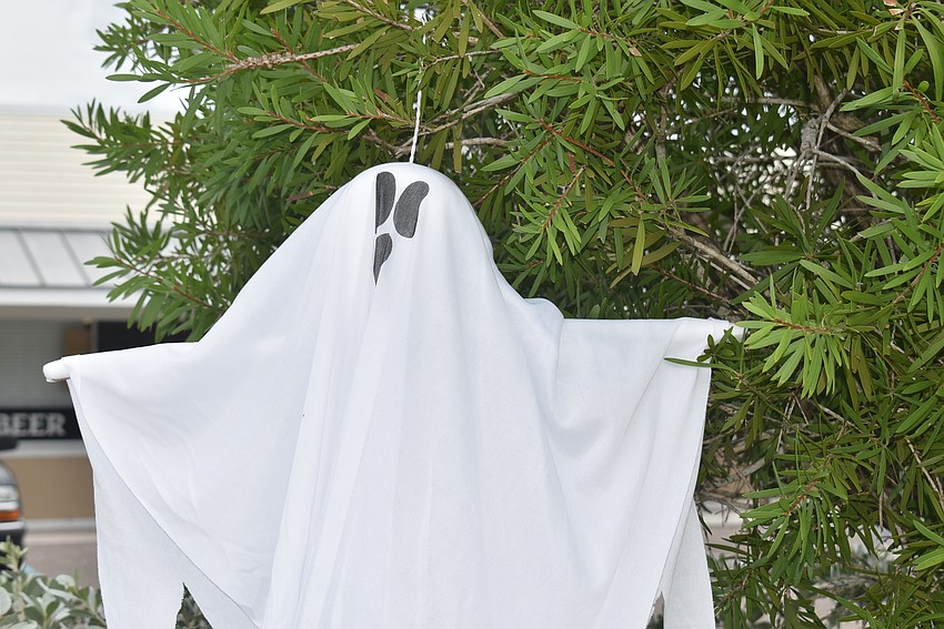 Ghastly ghosts stand watch outside Chubby's Lounge on Gulf of Mexico Drive.