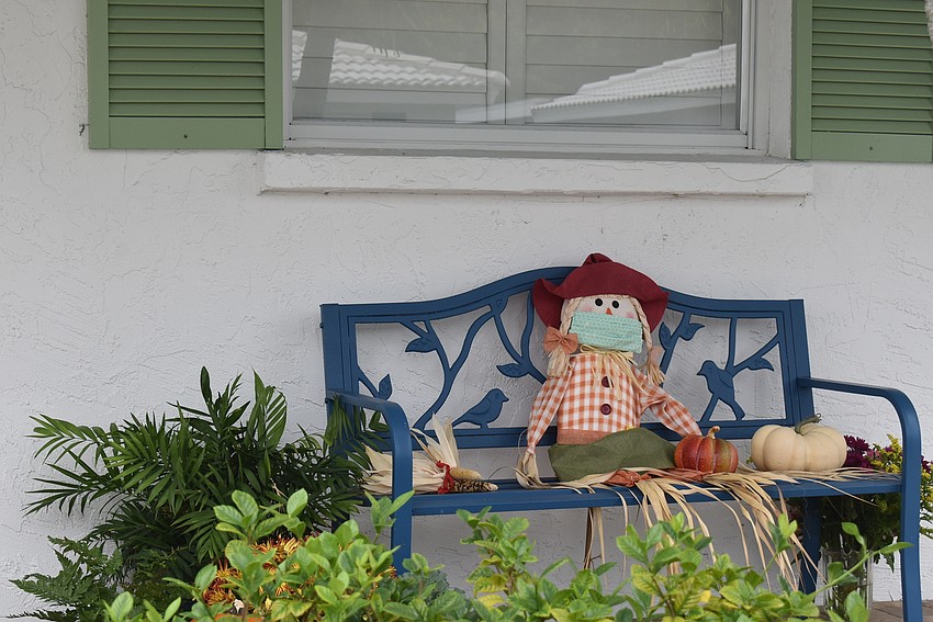 Masked and distanced. This scarecrow embodies the scariest thing of all — 2020.