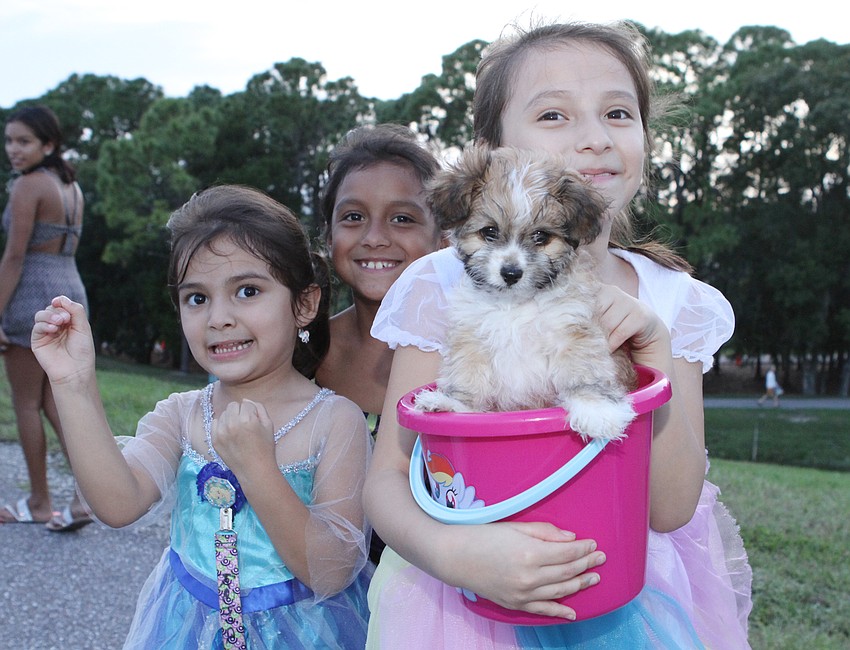 Kenia Mata, Anahi Iracheta and Cayla Mata made sure to bring Mr. Mocha the puppy.