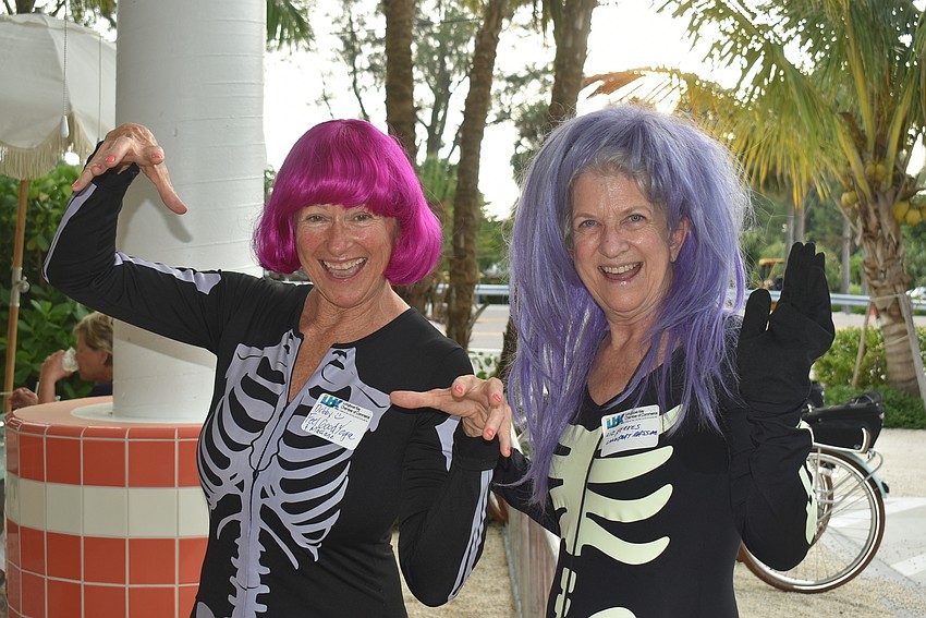 Debby McClung and Liz Yerkes dressed as skeletons.