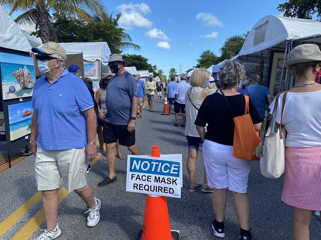 This weekend&#39;s Siesta Fiesta festival, rescheduled from April, featured signs reminding visitors that masks were required. Organizer Howard Alan hopes events can continue to go on during the pandemic. Courtesy photo.