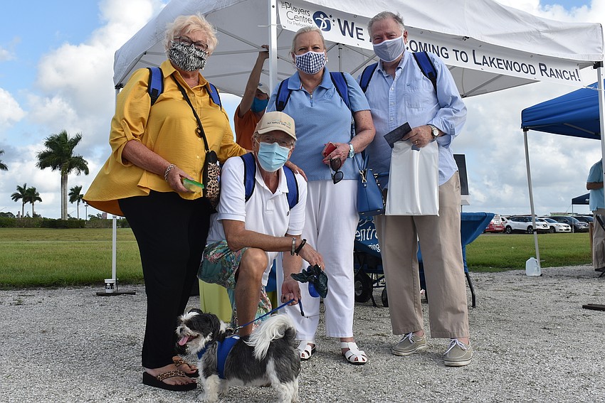 (From right) Grant Hamilton and Susan Hamilton of Lakewood Ranch and Harold Murtz and Kathy Murtz of Sarasota pose with Bandit, a 7-year-old Shih Tzu. The Murtzes said they want to get involved in the community.