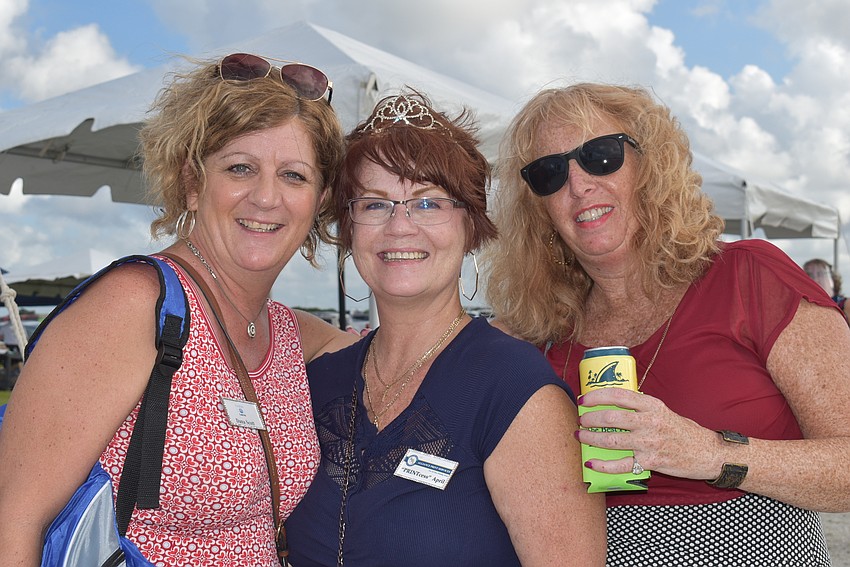 (From left) Donna St. Jean of Andrews Insurance Agency, April Pyle of Alliance Print Services and Dana Scott of Custom ComTek came to the event for networking. Pyle wore a tiara to mark her title as the 