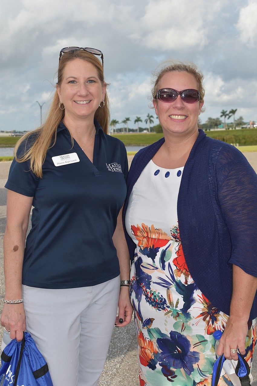 Dianne Kopczynski (left) and Stacia Deitrich work for Mauldin & Jenkins in downtown Bradenton. Kopczynski said it was the first event she had been to during the COVID-19 pandemic.