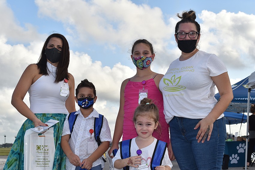(From left) Kristina Pajevic, Xavier Pajevic, Izabella Pajevic, Juniper Sanchez and (front) Dakota Sanchez represent Crystal Clean Green Cleaning, which serves Lakewood Ranch and Sarasota.