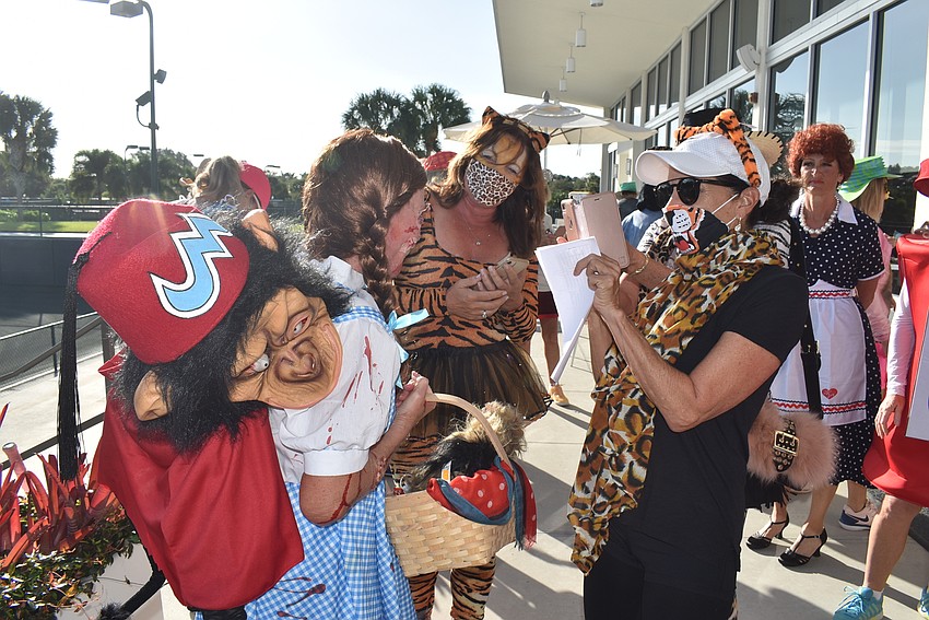 Judy Koslowski, right, snaps a photo of Debbie Dean's grisly Dorothy.