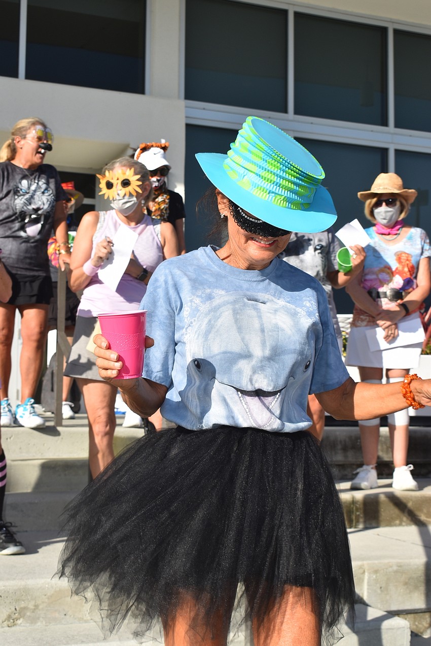 Mary Lou Johnson revealed her face as she walked down to the court.