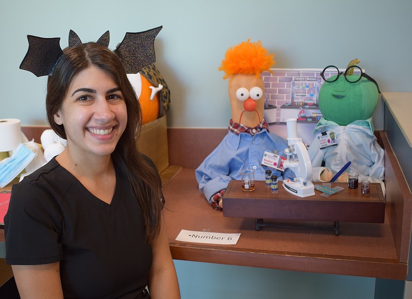 Bridget Maltese of the lab department accepted the prize winning snacks for her department's display.