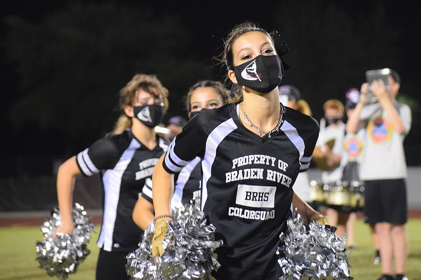 Nicole Stratford dances along with the color guard as the band plays pep band songs.