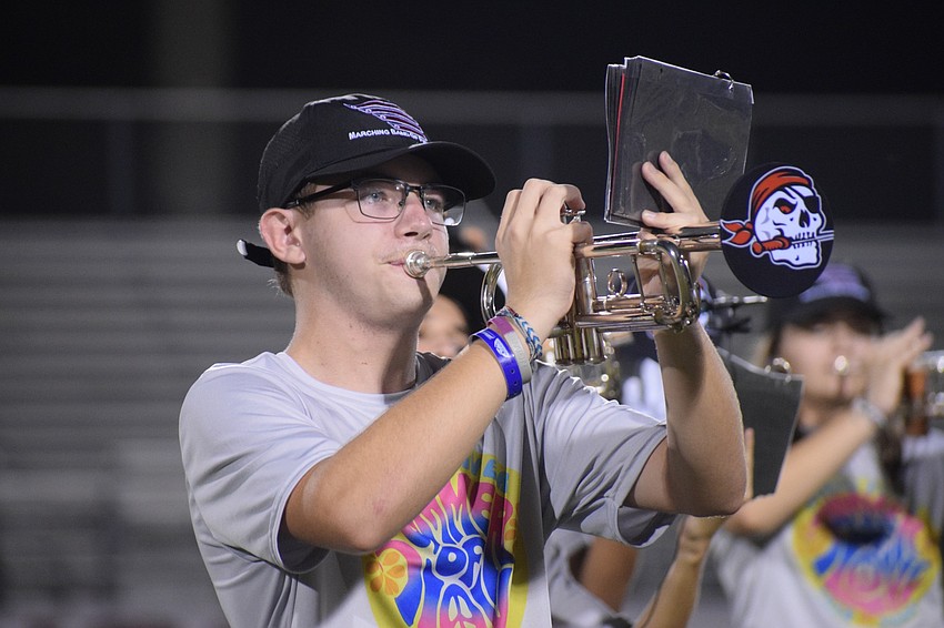 Adam Sicard belts out notes with his trumpet during the performance.