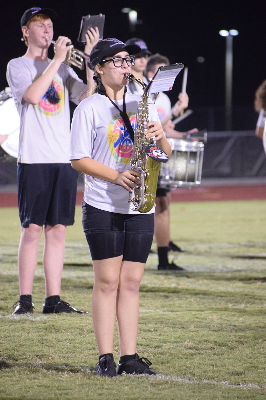 Chris Bowers and Laura Norat play pep band songs to start off the Community Night Showcase.