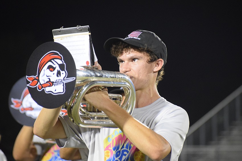 Andrew Muzquiz focuses while playing a pep band song.