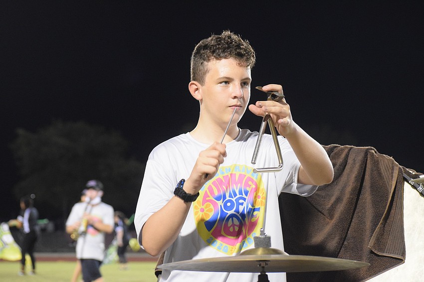 Carter Sirota waits for his beat to play the triangle.