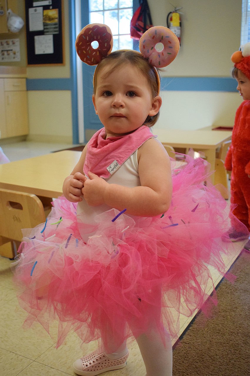 Mia Medeiros loves her donut costume.