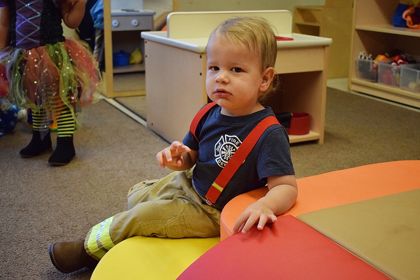 Lucas Crittenden waits for his class' Parade of Costumes to start at Primrose School at Lakewood Ranch Town Center.