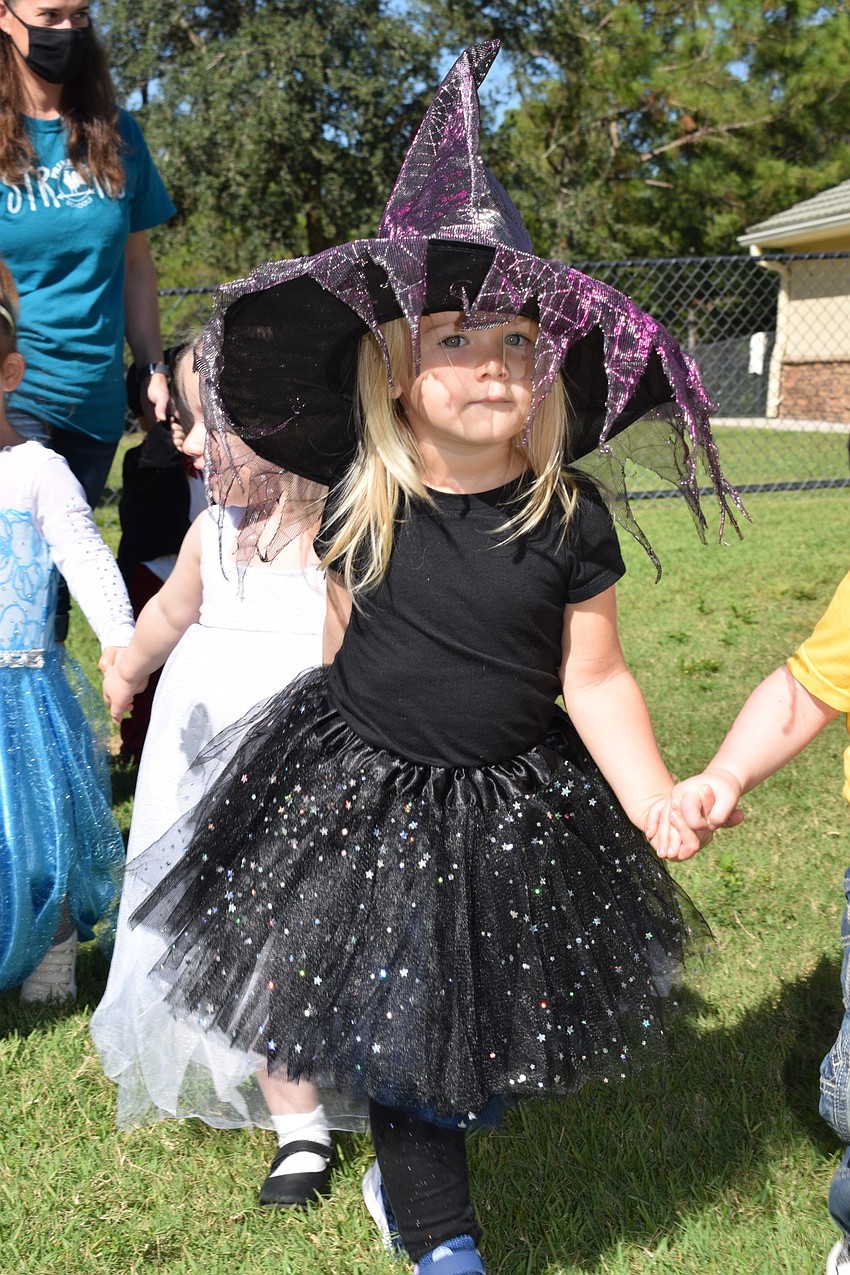 Rebeka Parrag walks with her classmates in the Parade of Costumes at Primrose School at Lakewood Ranch Town Center.