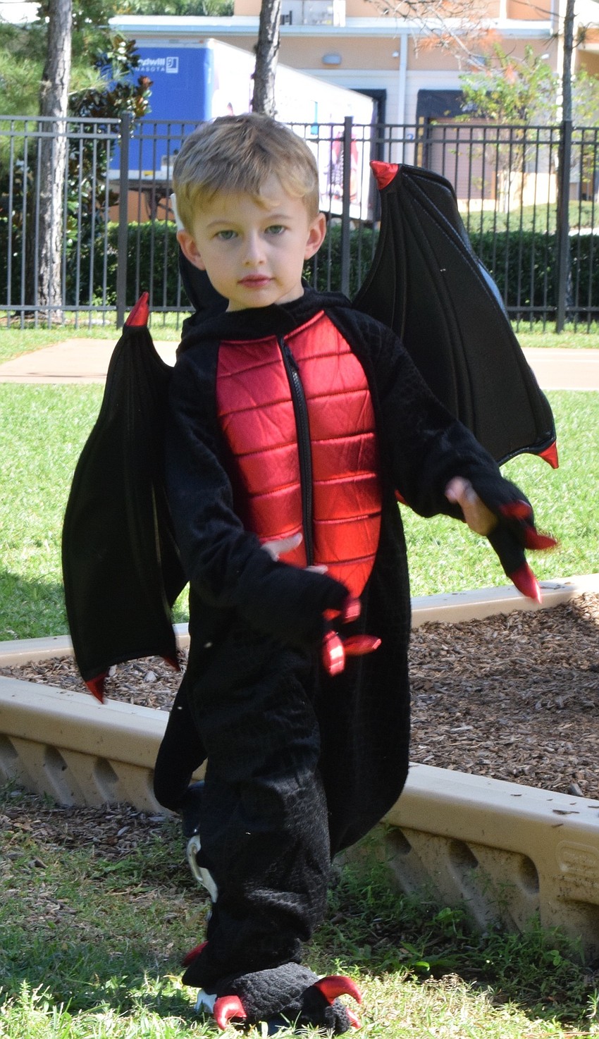Thomas Whittinghill shows off his dragon costume.