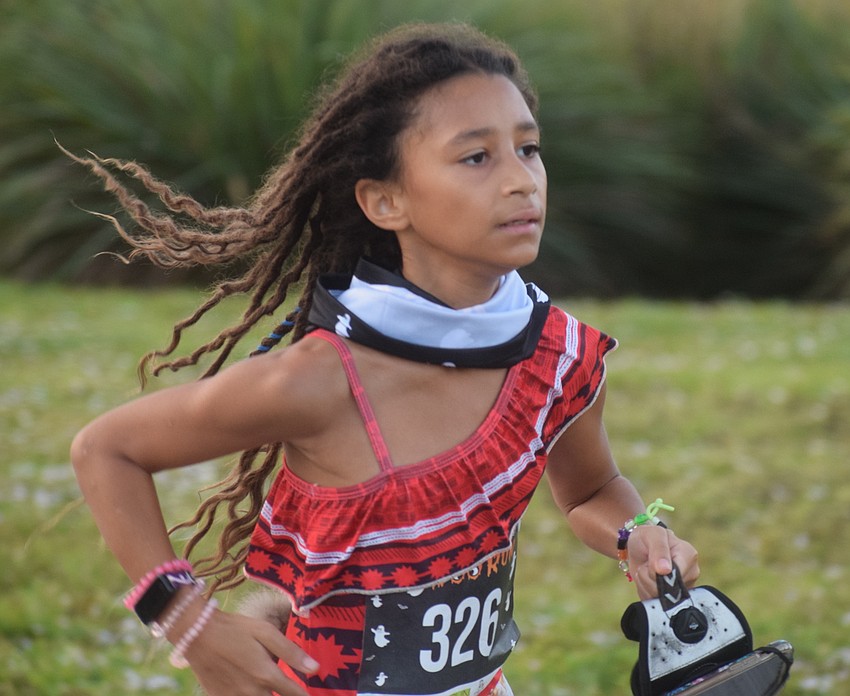 Lakewood Ranch 10-year-old Shadai Magra was the first youth runner to finish the Boo Run. She ran a personal best 25:01.
