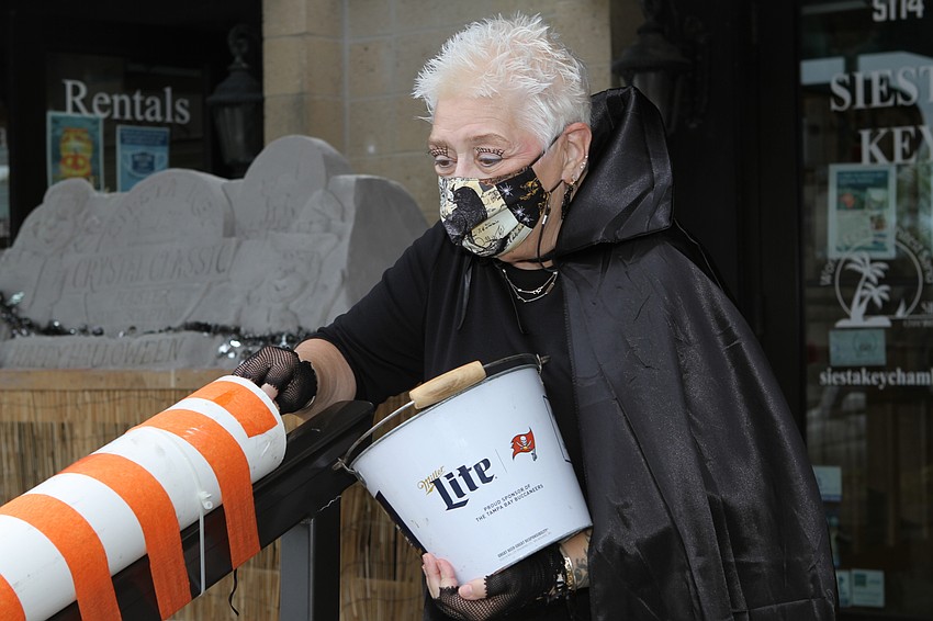 Mary Van Withey dropped candy down to children.