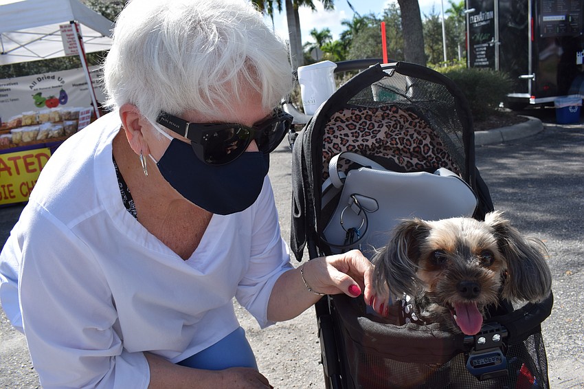East County's Pam Gordon and her poodle-Yorkie mix, Cloie, enjoyed the Market at Lakewood Ranch on the opening day.