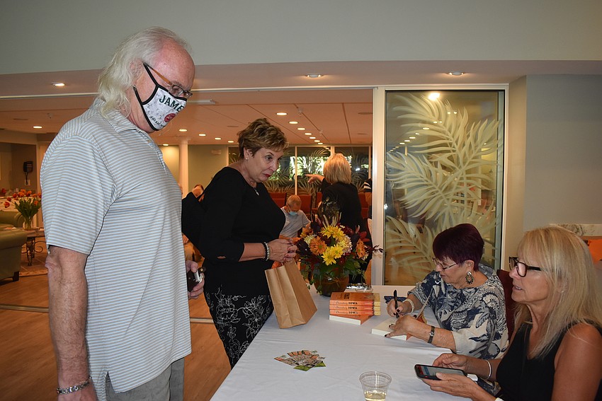 Michael Jordan buys a book from Janine Wile.