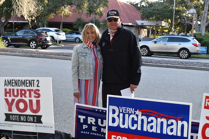 Jackie and Scott Gray of the Republican Club of Longboat Key pose for a photo on Tuesday outside of Town Hall.