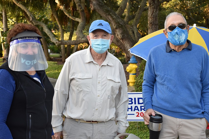 Arlene Skversky, Bob Gary and Paul Skversky of the Longboat Key Democratic Club pose for a photo Tuesday outside of Town Hall.