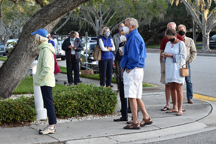 The line of people at Town Hall’s Precinct 201 wrapped around onto Bay Isles Road.