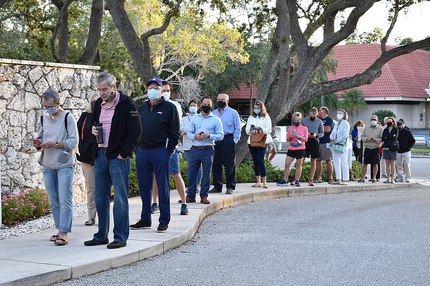 The line of people at Town Hall’s Precinct 201 wrapped around onto Bay Isles Road.