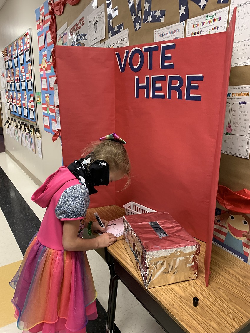First grader Capri Pella fills out her ballot. Courtesy photo.