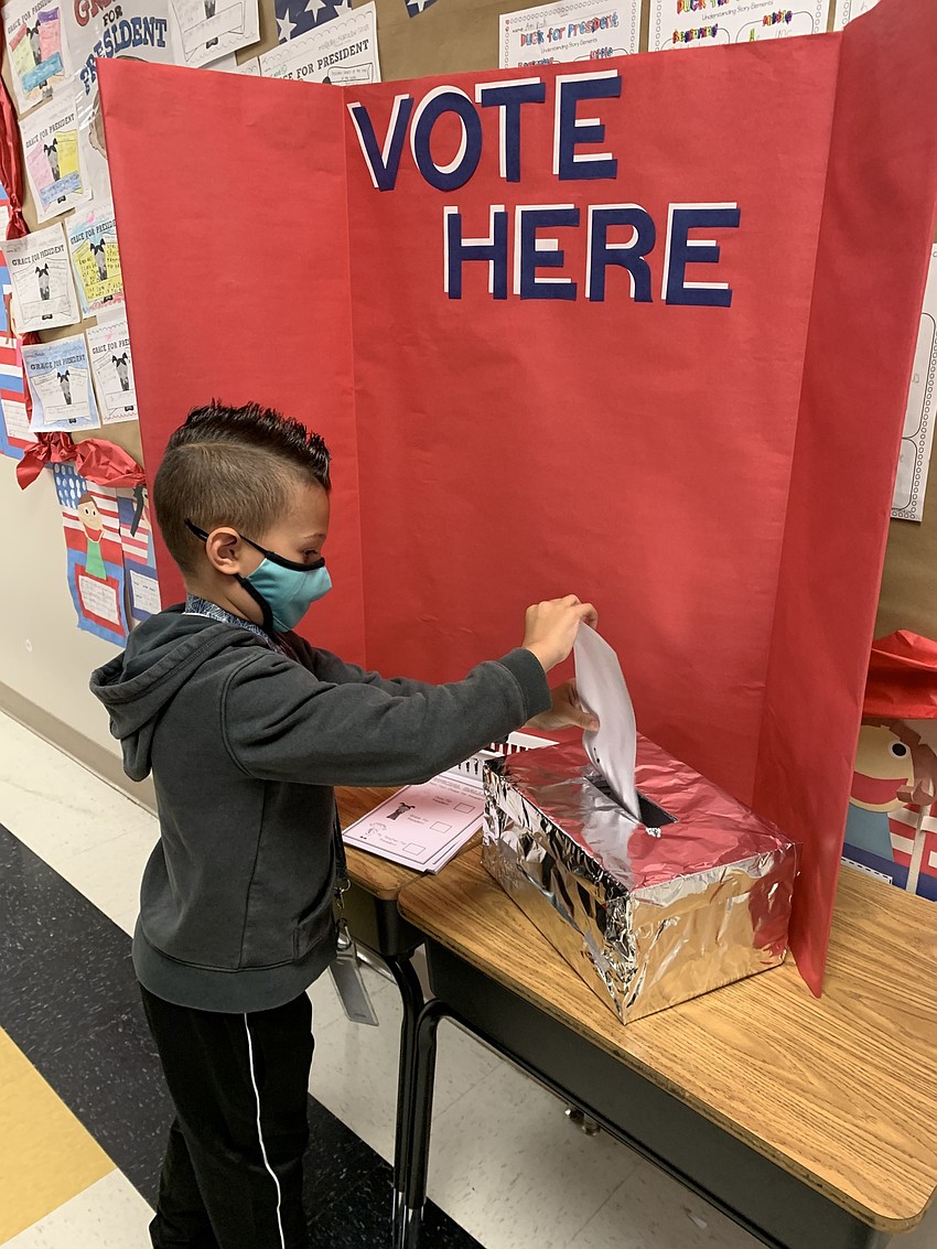 First grader Landon Lopez casts his ballot for president. Courtesy photo.