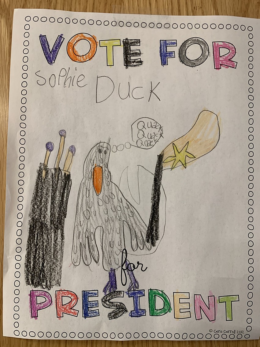 First grader Sophie Nathans-Pavese creates a drawing to show support for Duck, a candidate for president. Courtesy photo.