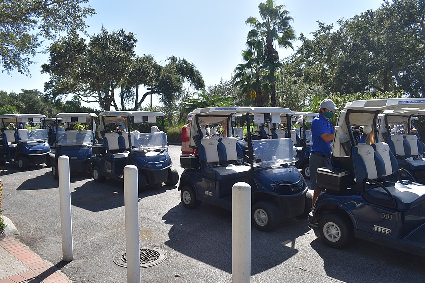 Golfers parked their carts and then headed to their lunch tables just steps away.