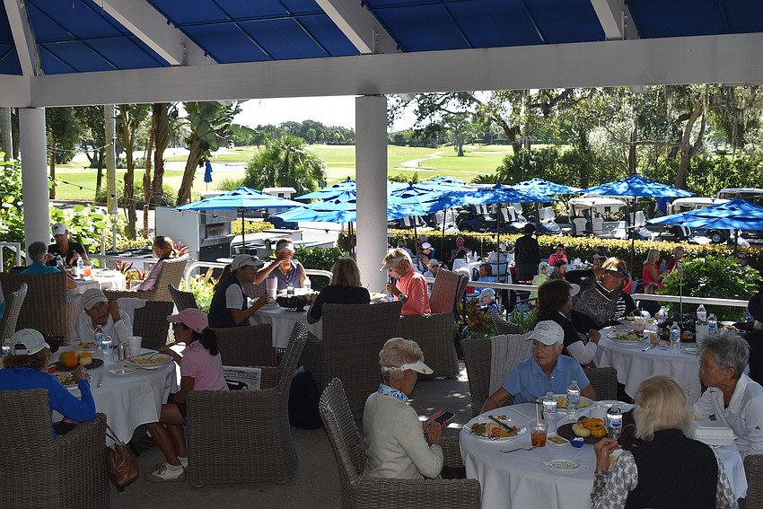 The golfers sat on both levels of the patio.
