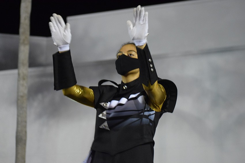 Drum major Victoria Pugh directs the band.