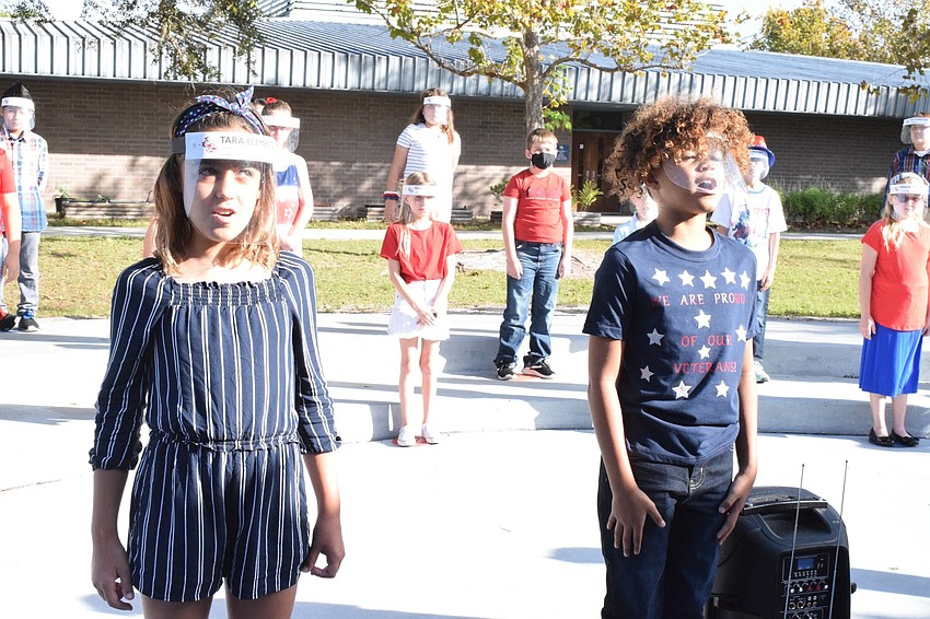 Fourth graders Joei Fulghum and Jordan Ellis sing their solos.