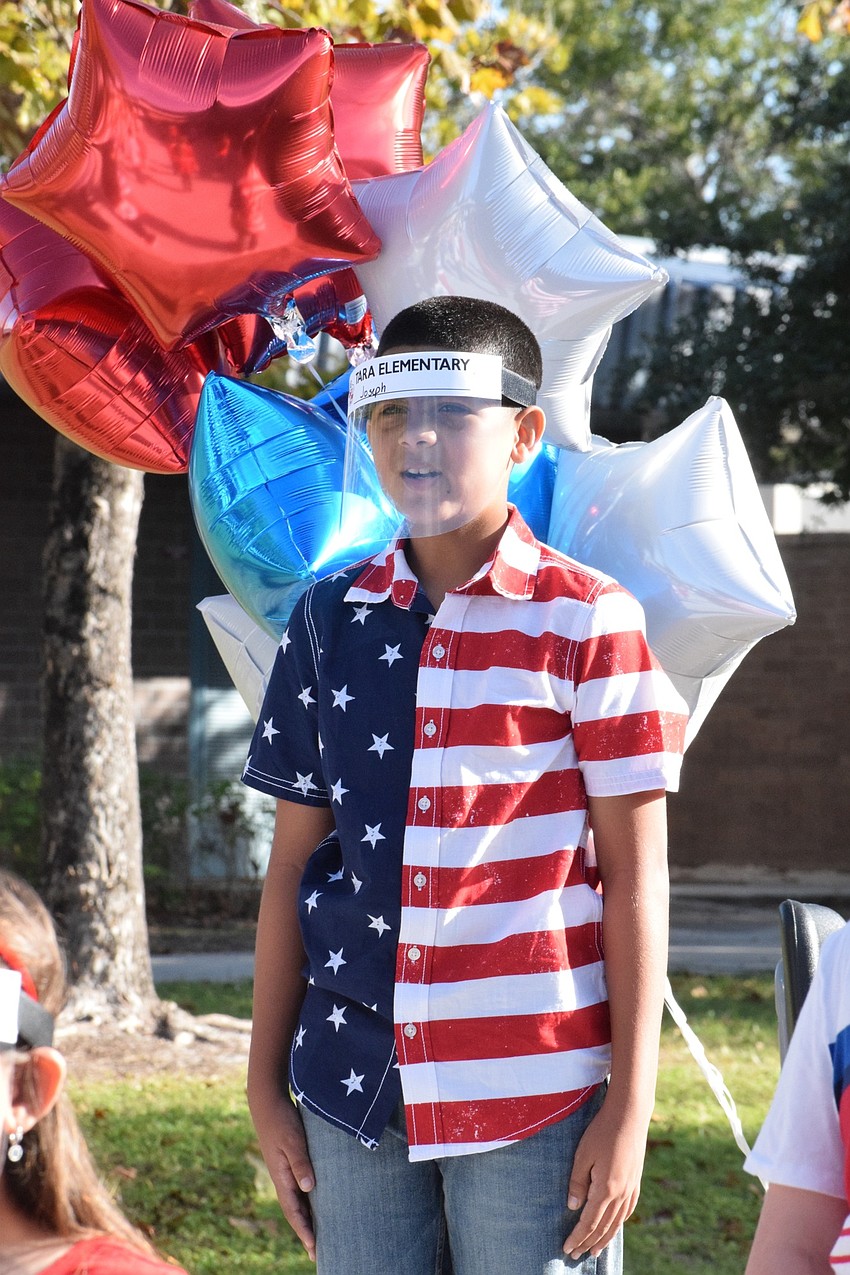 Fourth grader Joseph Lopez-Otara brings American spirit to the assembly with his American flag shirt.