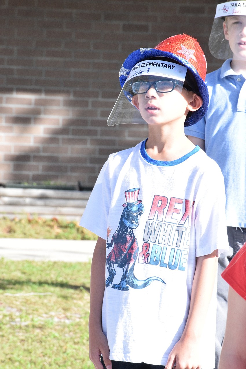 Fourth grader Jayden Bui has fun during the Veterans Day assembly.
