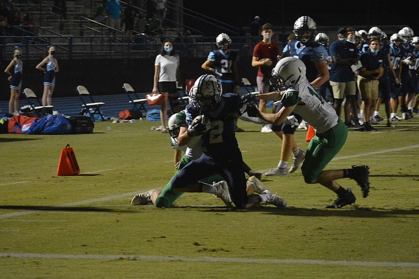 Ashton Lamb falls forward into the red zone.