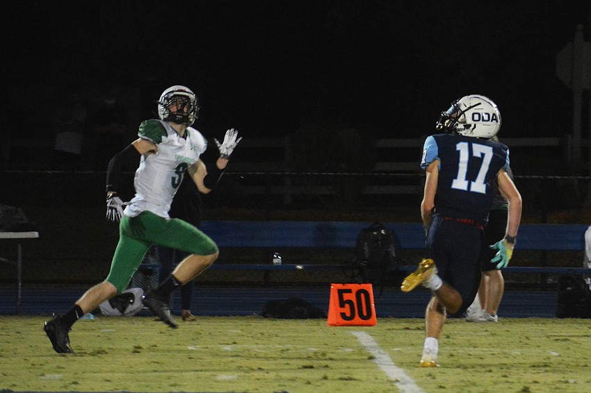 Connor Pope (17) track down an Ocala pass alongside an Ocala wideout. The pass would fall incomplete.