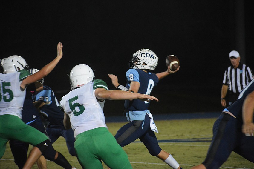 Patch O'Keefe fires a pass to his right.