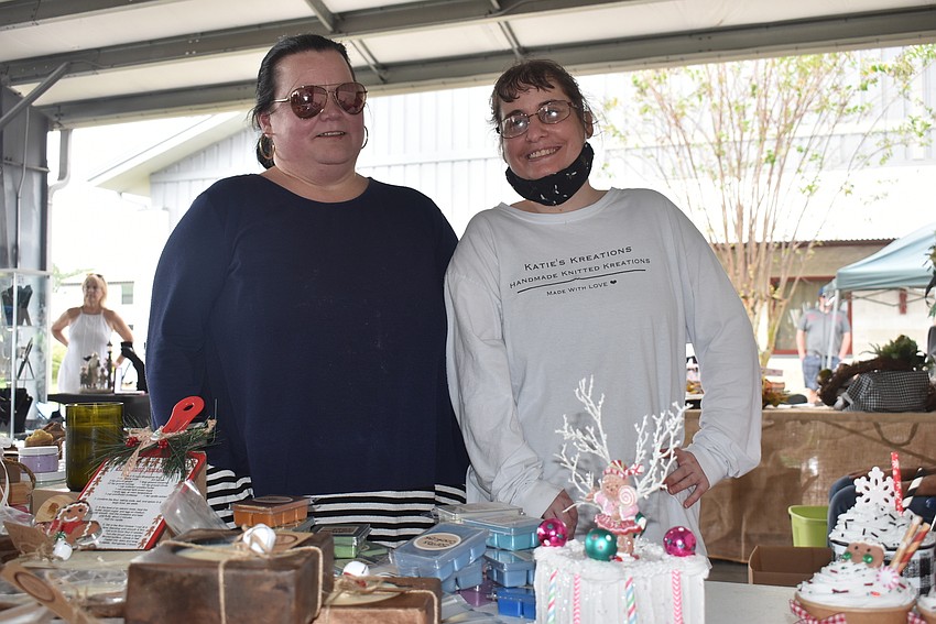 Andrea Riccitelli (left) and Kate Farrens operate the booth for Katie's Kreations, which sells knit hats, blankets, scarfs, soaps and more. Farrens is a participant at Night with the Stars Prom.