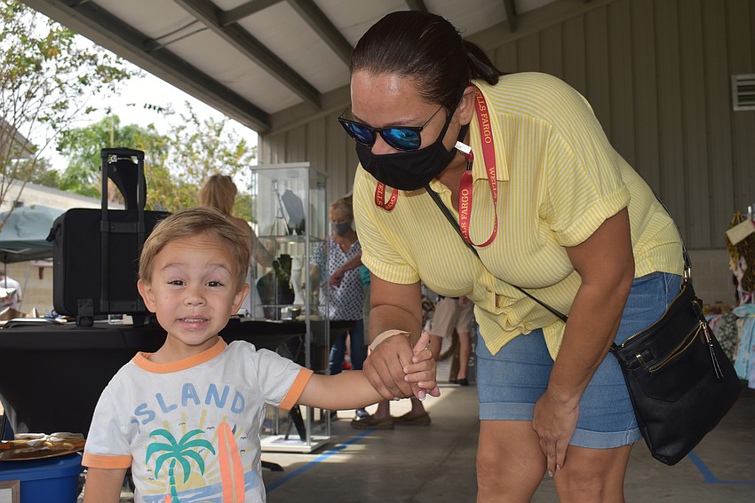 Al Kull (right) and her son, Ryan Kull, of Palmetto came to the craft show to check out the merchandise.