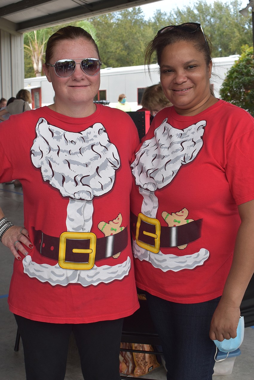 Kelley Van Prooyen (left) and Melba Cuevas of Ellenton sell lead- and nickel-free jewelry for Paparazzi. All of their products are $5 or $1 for kids' products.