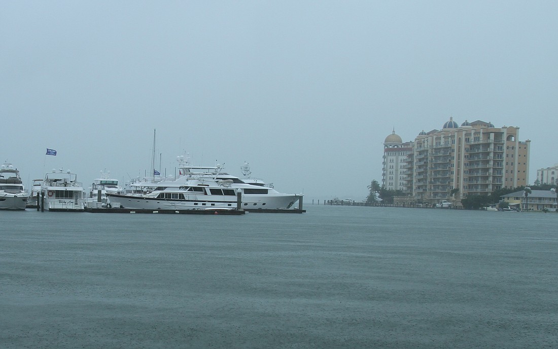 Sarasota Bay waters remained relatively calm on Wednesday, though heavy rains fell.