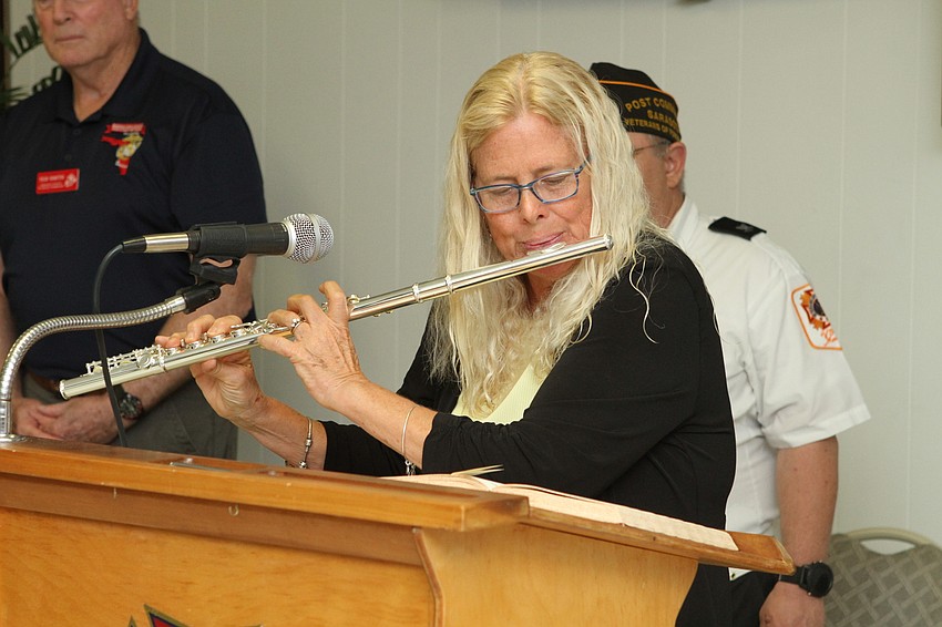 “Sarasota Town Grandma” Jan Hamel Solomon played the flute for the crowd.
