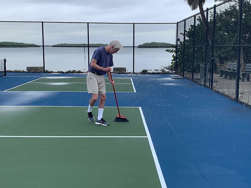 Doak Schulte from Northern Kentucky was out early to prepare the Bayfront Park pickleball courts for play. (Mark Bergin)