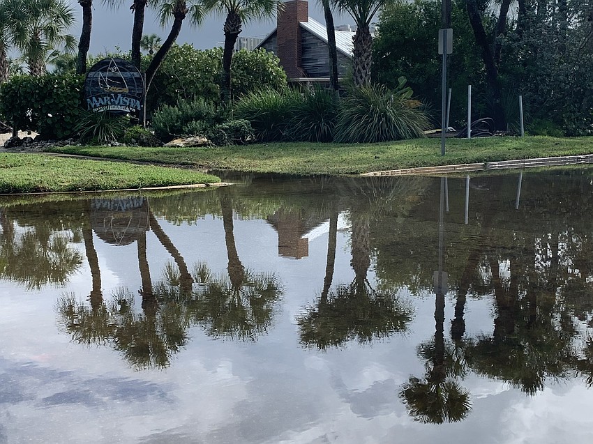Flooding along Broadway Street in Longbeach Village has receded a bit. (Mark Bergin)