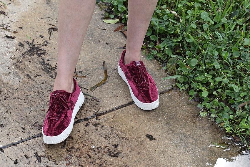 Vashti Braha had one pair of shoes with thick enough soles to keep dry. (Nat Kaemmerer)