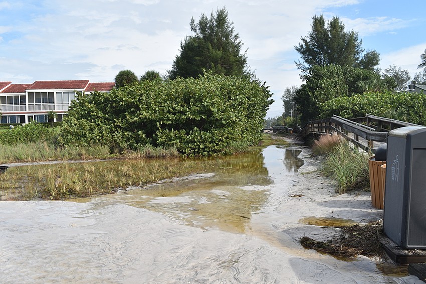 Beach erosion is shown at the public beach access point near 100 Broadway St.